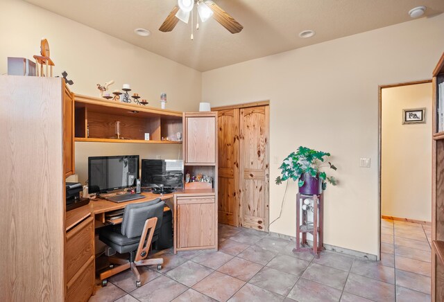 office area with ceiling fan and light tile patterned flooring