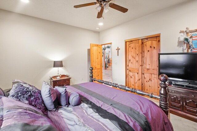 carpeted bedroom with ceiling fan