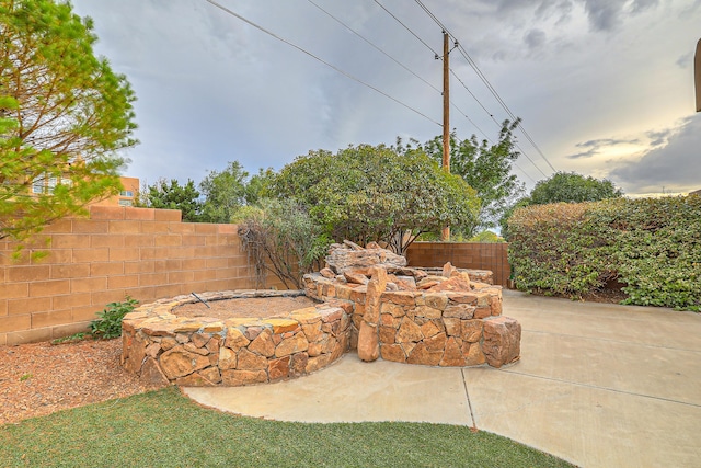 view of patio / terrace with an outdoor fire pit and a fenced backyard