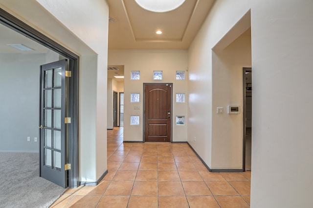 foyer entrance featuring light tile patterned floors, visible vents, recessed lighting, and baseboards