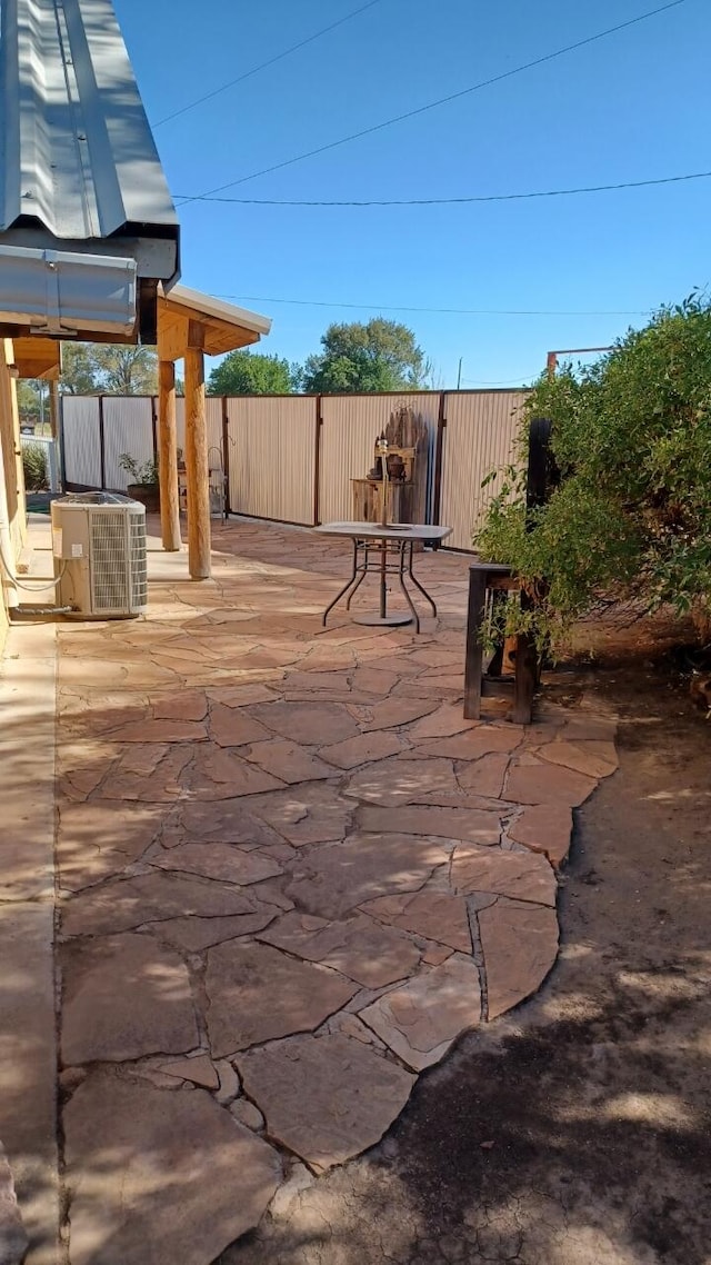 57 Edmundo Rd, Belen, NM 87002 - view of patio with cooling unit and a wooden deck