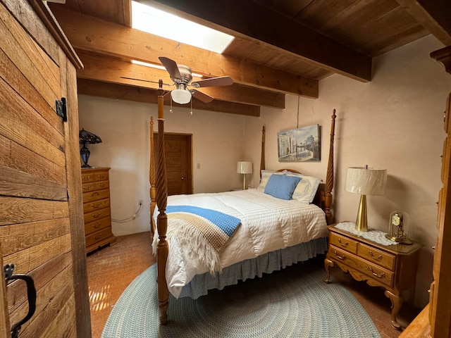 57 Edmundo Rd, Belen, NM 87002 - bedroom featuring wood ceiling, ceiling fan, beamed ceiling, and carpet floors