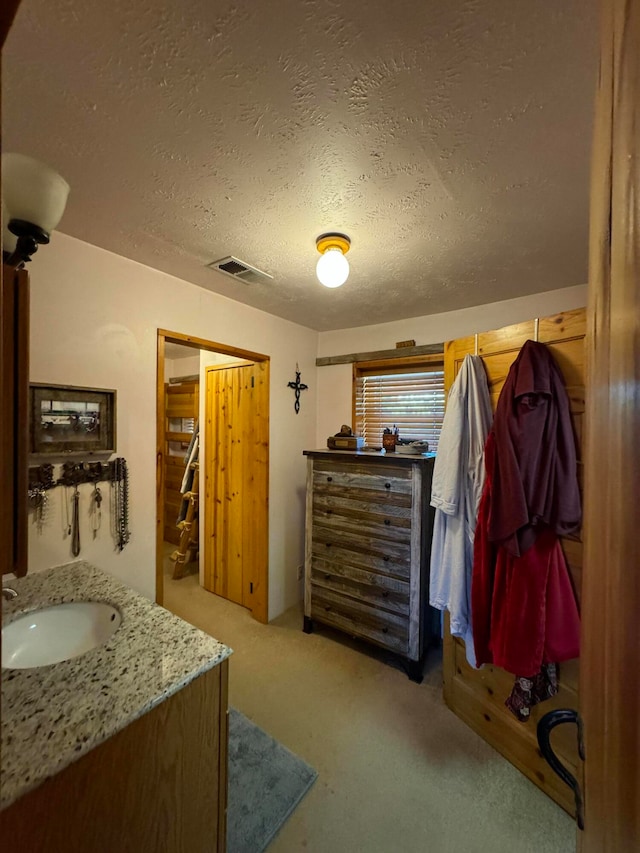 57 Edmundo Rd, Belen, NM 87002 - interior space with a textured ceiling and sink