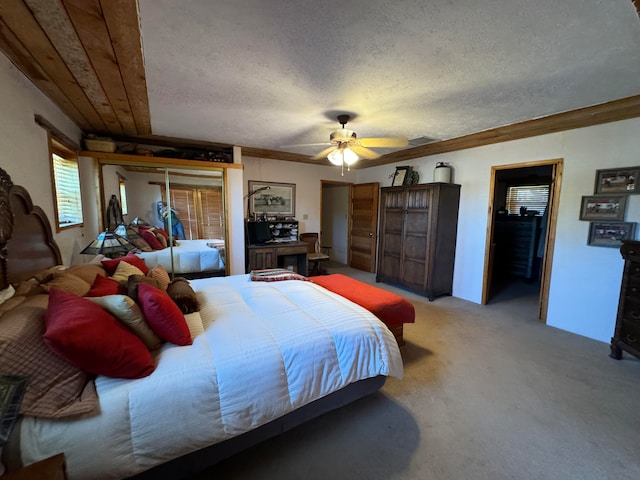 57 Edmundo Rd, Belen, NM 87002 - bedroom with a textured ceiling, ceiling fan, and carpet