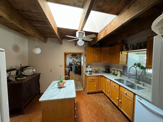 57 Edmundo Rd, Belen, NM 87002 - kitchen with beamed ceiling, light stone countertops, dishwasher, sink, and ceiling fan