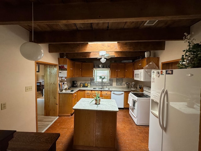 57 Edmundo Rd, Belen, NM 87002 - kitchen featuring white appliances, backsplash, a kitchen island, sink, and beam ceiling
