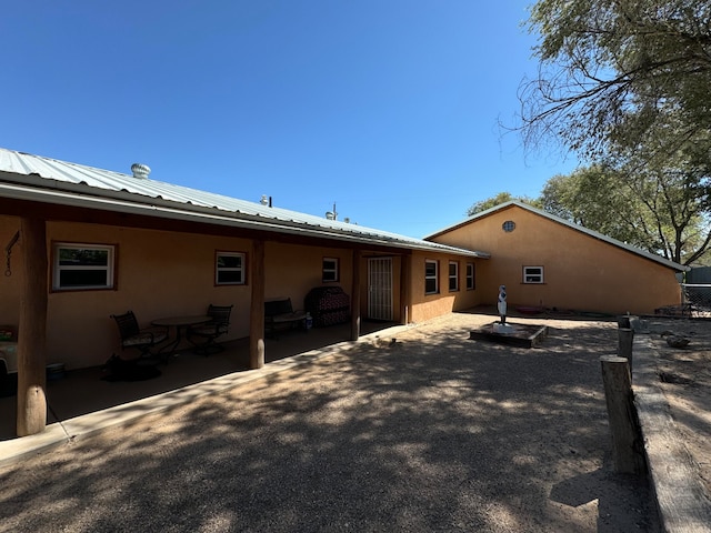 57 Edmundo Rd, Belen, NM 87002 - rear view of house with a patio
