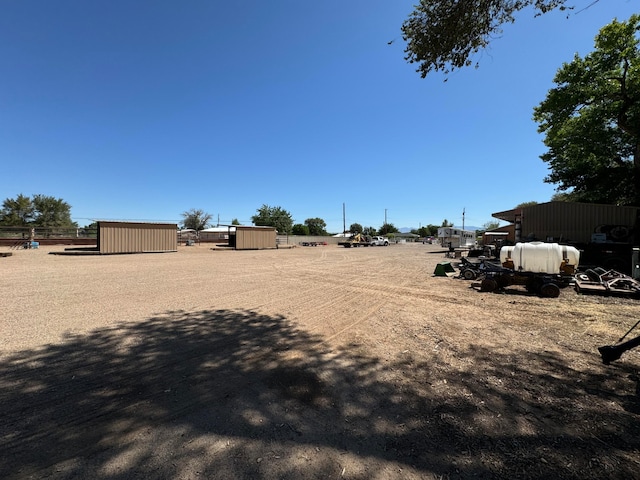 57 Edmundo Rd, Belen, NM 87002 - view of yard featuring a storage unit