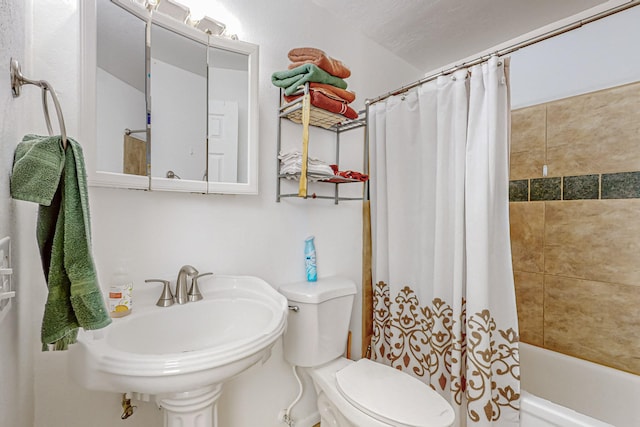 full bathroom with toilet, sink, and shower / bath combo