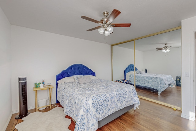 bedroom featuring a closet, ceiling fan, and hardwood / wood-style floors