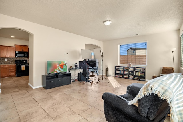 tiled living room with a textured ceiling