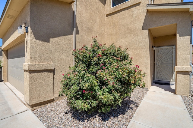 view of side of property with a garage