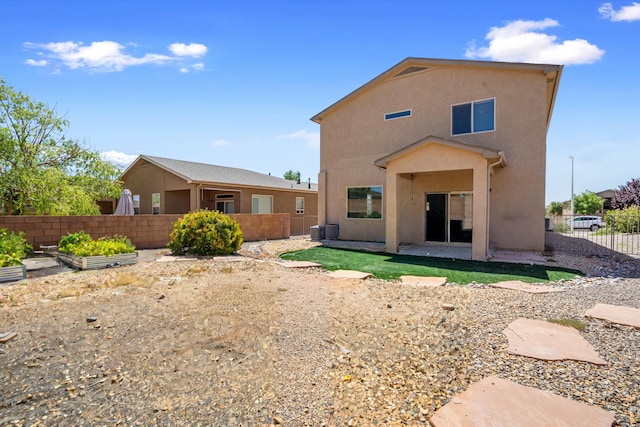 rear view of house with a patio