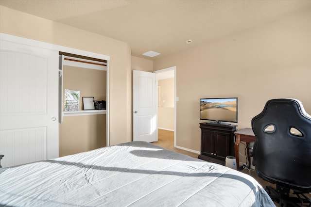 carpeted bedroom featuring a closet