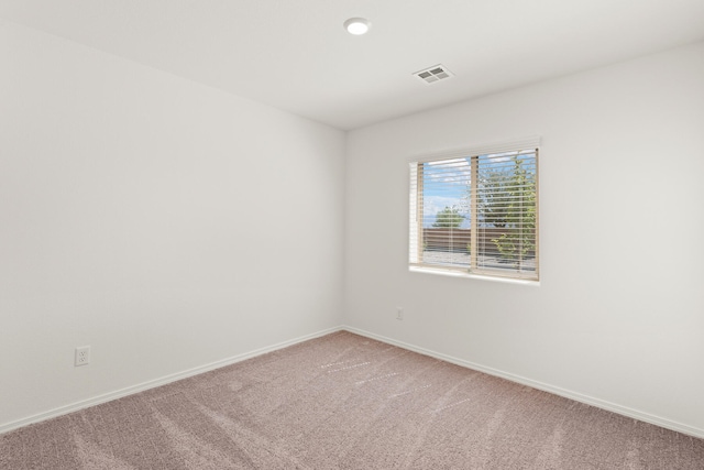 empty room featuring carpet floors