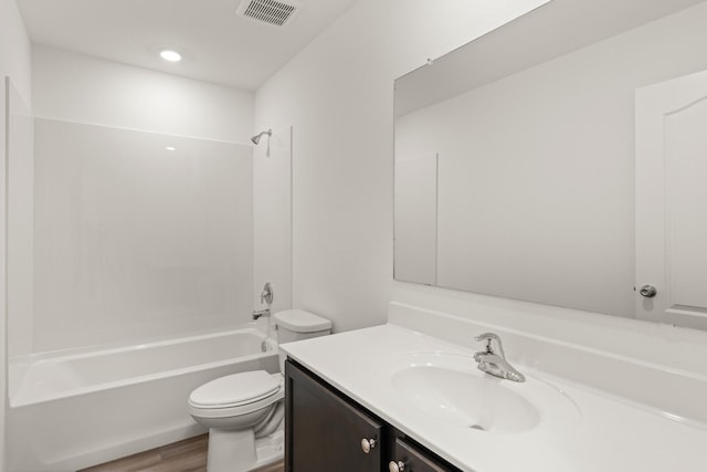 full bathroom with vanity, toilet, shower / bathtub combination, and hardwood / wood-style floors