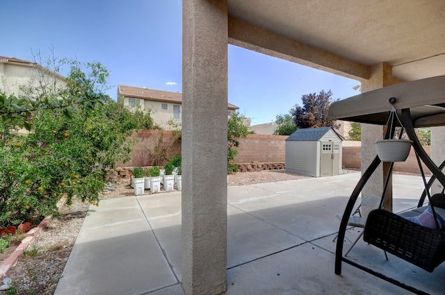 view of patio with a shed