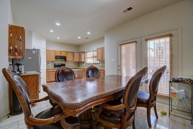 dining room with light tile patterned flooring