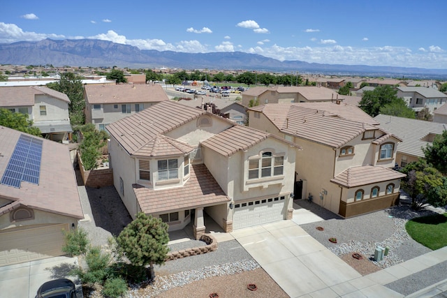 birds eye view of property with a mountain view