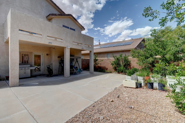 back of house featuring a patio and cooling unit