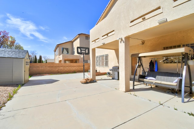 view of patio with a storage unit