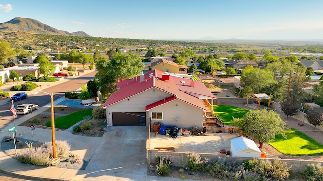 drone / aerial view featuring a residential view and a mountain view