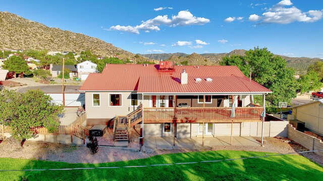 back of house with a mountain view