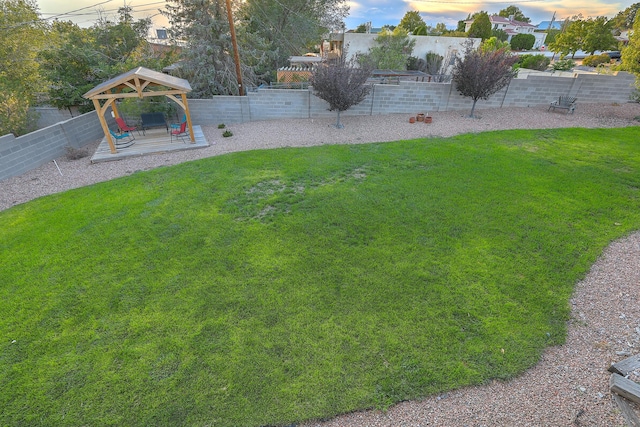 view of yard with a gazebo, a patio area, and a fenced backyard