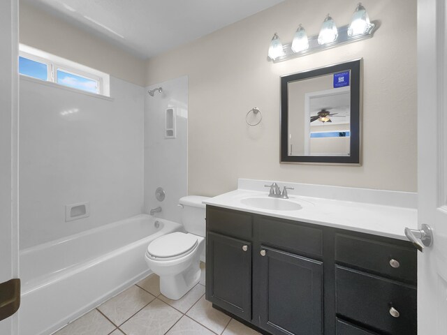 full bathroom with tile patterned flooring, bathtub / shower combination, toilet, ceiling fan, and vanity