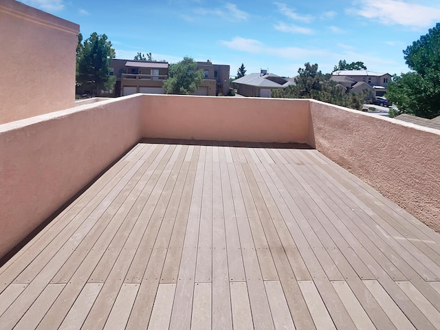 wooden terrace featuring a residential view