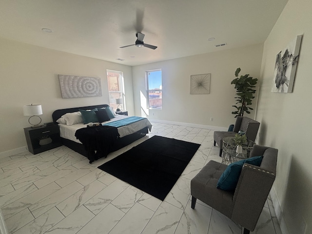 bedroom with visible vents, baseboards, marble finish floor, and a ceiling fan