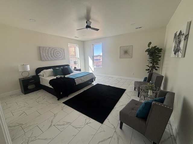 bedroom featuring a ceiling fan, visible vents, marble finish floor, and baseboards