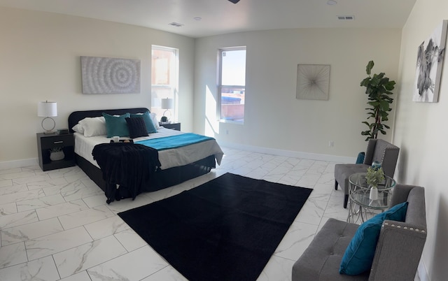 bedroom with visible vents, baseboards, and marble finish floor