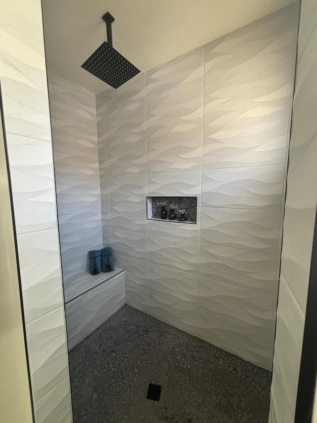 bathroom with tiled shower