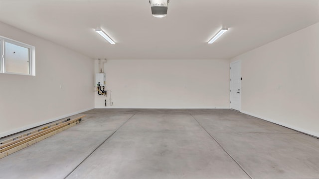 garage with tankless water heater and a garage door opener