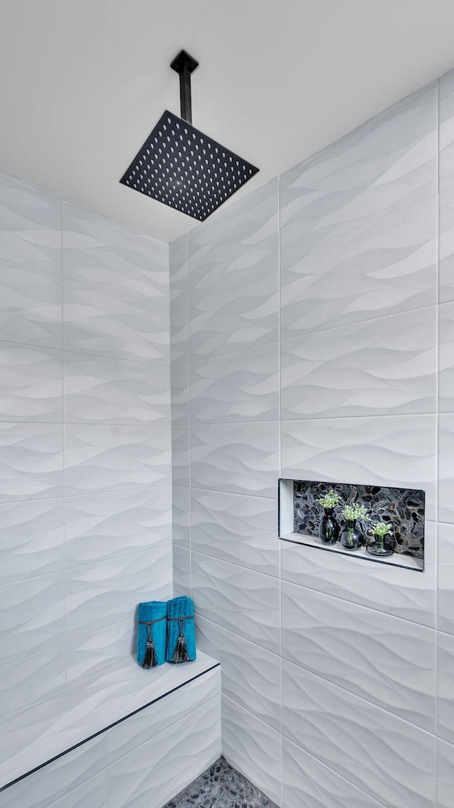 room details with a tile shower