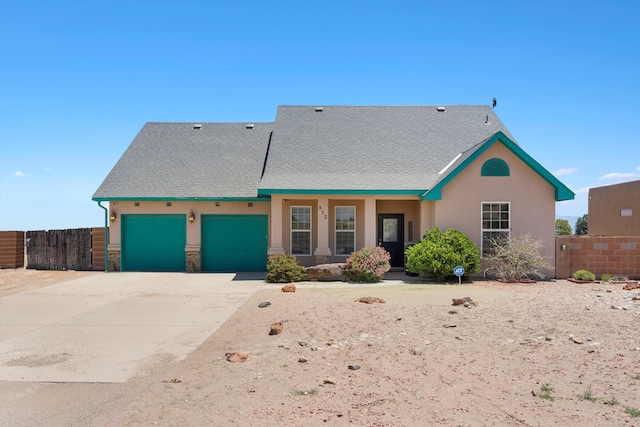 view of front of property with a garage