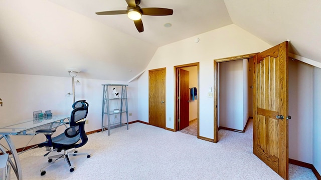 carpeted office space with lofted ceiling and ceiling fan