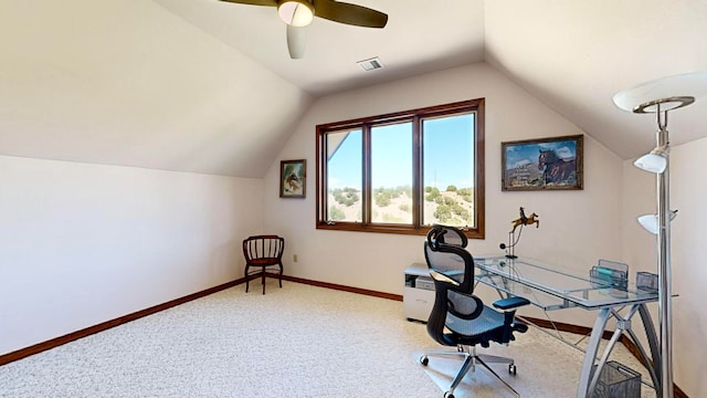 carpeted home office with vaulted ceiling and ceiling fan