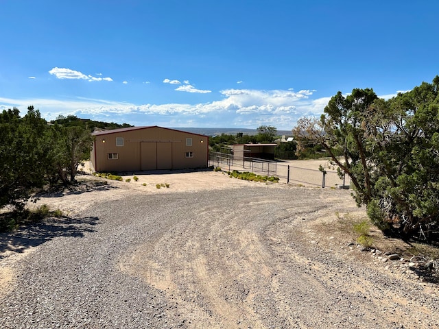 view of yard featuring an outbuilding and a rural view