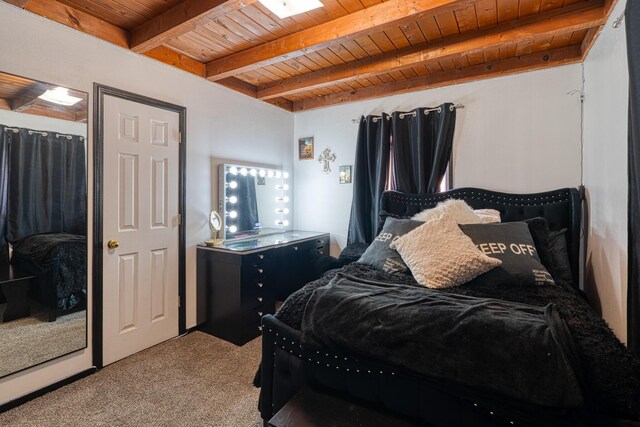 carpeted bedroom with wooden ceiling and beam ceiling