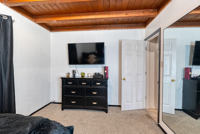 bedroom featuring light colored carpet, beamed ceiling, and wooden ceiling