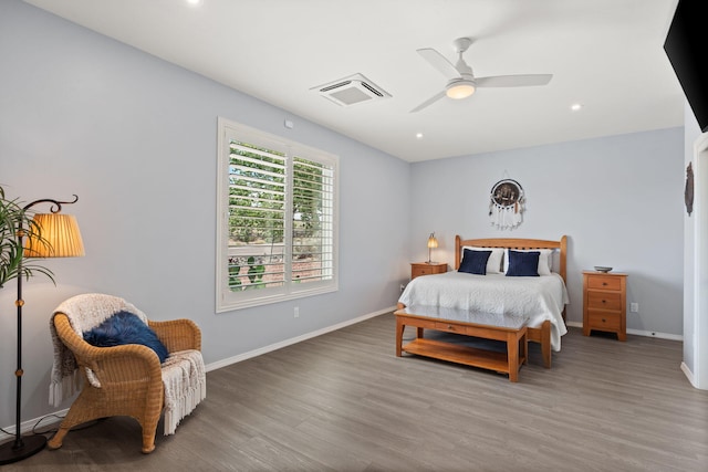 bedroom featuring ceiling fan and hardwood / wood-style flooring