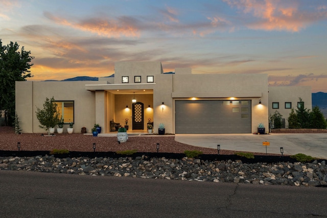 adobe home featuring a garage