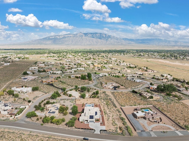 birds eye view of property featuring a mountain view