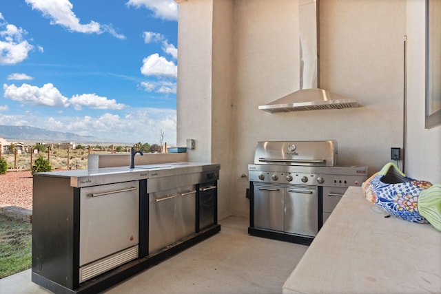 view of patio / terrace featuring area for grilling, grilling area, and a mountain view