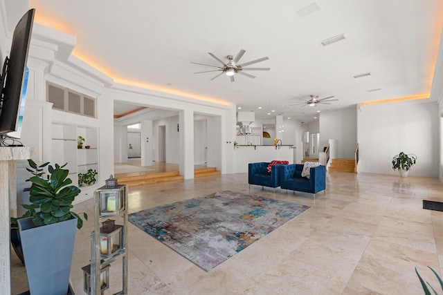 living room featuring ceiling fan and light tile patterned flooring