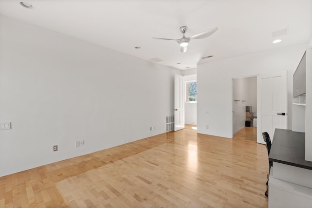 unfurnished living room with light wood finished floors, ceiling fan, and visible vents