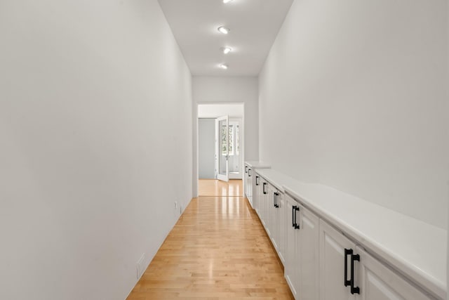 hall with light wood-type flooring