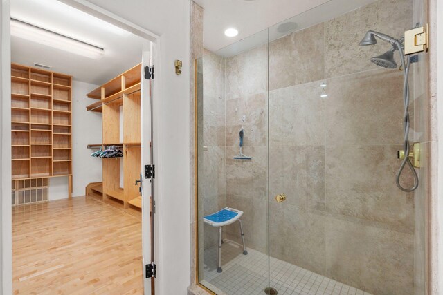 walk in closet featuring light hardwood / wood-style floors